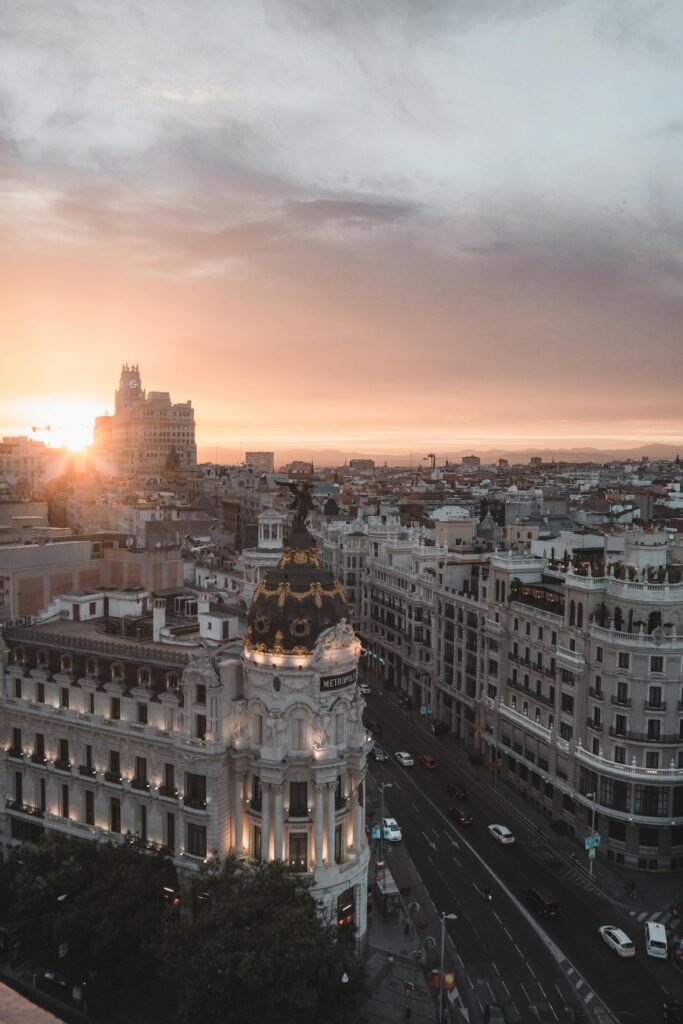 pexels photo 3722818 3722818 Stunning view of Madrid cityscape with sunset over the Metropolis Building.